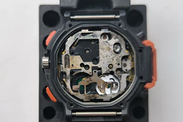 Module 734 in movement holder with case back removed showing discoloration.