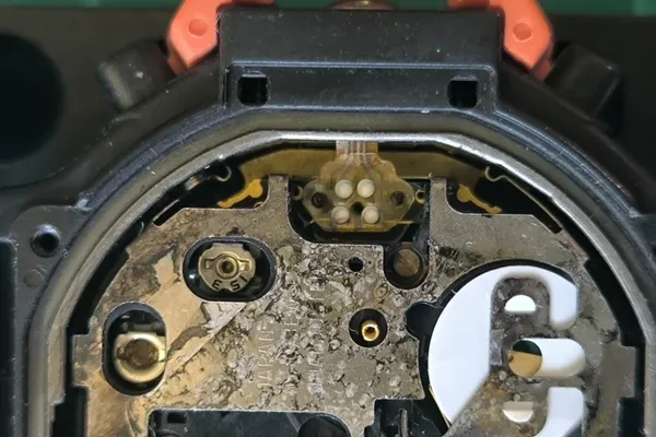 Altimeter sensor ribbon cable detached showing positioning bumps.