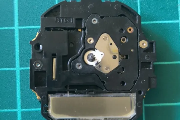 Front view of movement without dial and hands showing accessible LCD.